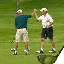 golfers high fiving on the course