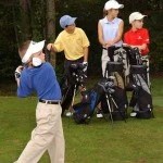 young golfer teeing off